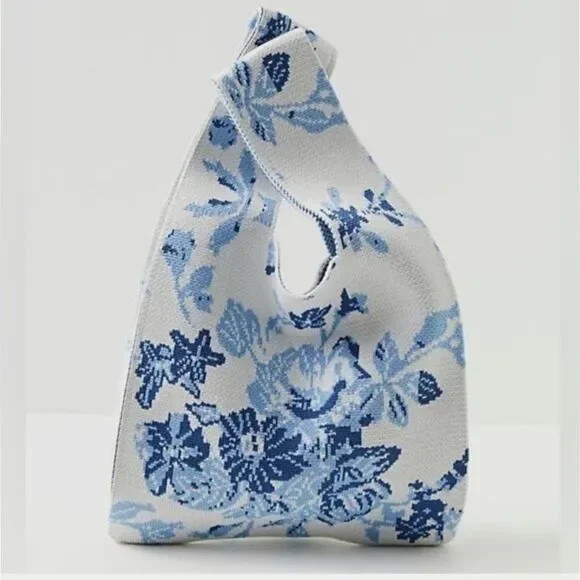 The Lucca Make It Mini Clutch is a knitted bag with a unique unstructured design - Picture 1 of 6